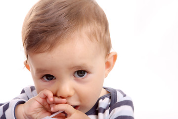 Image showing beautiful baby biting, baby studio photo