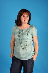 Image showing fashion woman on blue background studio shot