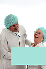 Image showing mature doctor couple, team of doctors, healthcare photo