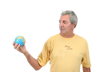 Image showing mature man holding globe, protection photo