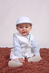 Image showing Portrait of a happy baby boy Isolated on grey background