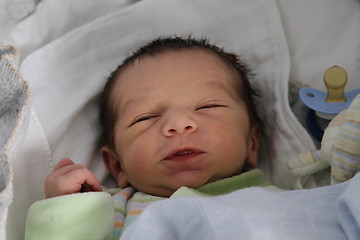 Image showing sweet baby sleeping on a blanket, newborn baby