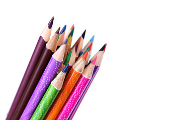 Image showing Assortment of coloured pencils with shadow on white background