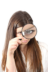 Image showing Young businesswoman holding Magnifying Glass, business photo