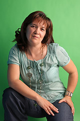 Image showing fashion woman on green background. studio shot.