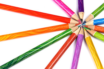 Image showing Assortment of coloured pencils with shadow on white background