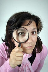 Image showing Young businesswoman holding Magnifying Glass, business photo