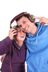 Image showing Man and mother enjoying music, studio photo