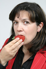 Image showing beautiful woman with beautiful red strawberries, healthy food