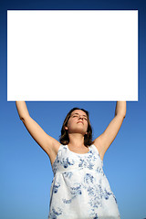 Image showing Young woman holding blank board