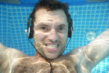 Image showing man underwater listen music with head-phones