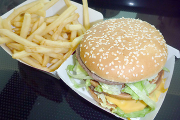 Image showing Tasty hamburger with fries, unhealthy food, health concept