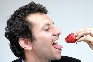 Image showing man with strawberries, healthy food photo