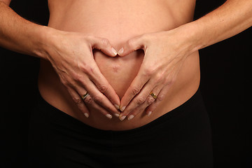 Image showing beautiful pregnant woman expecting a baby girl