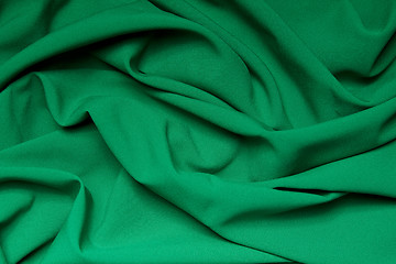 Image showing The folds of a bright green cloth. Abstract Background