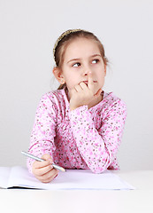 Image showing Schoolgirl making homework