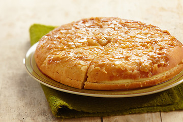 Image showing home made almond cake with butter cream

