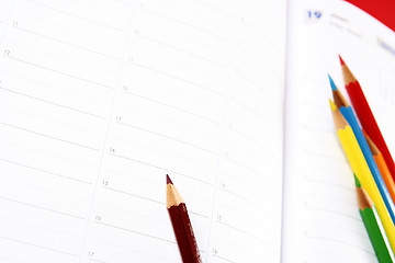 Image showing Color pencil and agenda