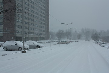 Image showing Picture taken during a winter storm that passed by the city - snow covered a street