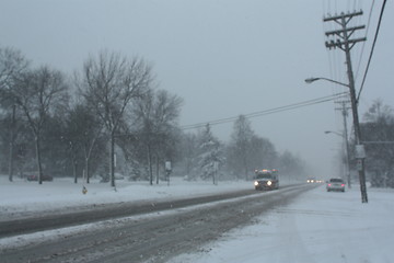 Image showing Picture taken during a winter storm that passed by the city - snow and sleet covered a busy street