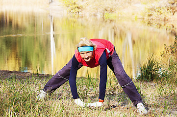 Image showing Woman making of the stretching in full nature 