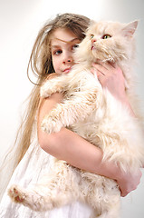 Image showing kid  with a Persian cat