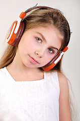 Image showing child with headphones listening to music