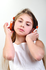 Image showing child with headphones listening to music