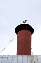 Image showing rusty tin chimney rooster weather vane weathercock 