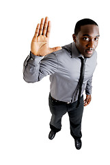 Image showing Business man with his hand up