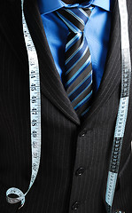 Image showing Business man with tape measure