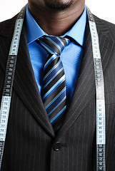 Image showing Business man with tape measure