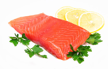 Image showing Salmon steak with lemon slice and parsley