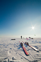 Image showing Close up of skis and the person in a distance
