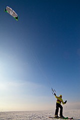 Image showing Ski kiting and jumping on a frozen lake