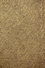 Image showing brown background with golden patterns