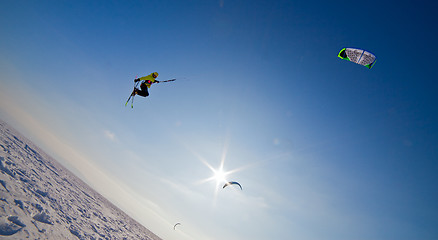 Image showing Ski kiting and jumping on a frozen lake