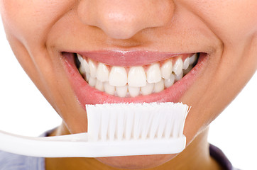 Image showing Afro-american girl brushing her teeth