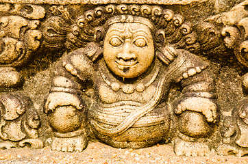 Image showing stone statues that support the arch of steps, leading to a holy 