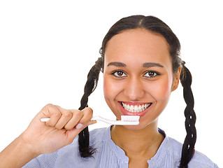 Image showing Afro-american girl brushing her teeth