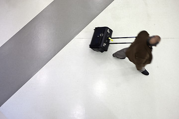 Image showing Moving people from above at the airport