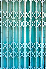 Image showing Illuminated grunge metallic roll up door