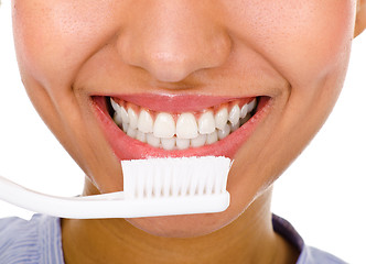 Image showing Afro-american girl brushing her teeth