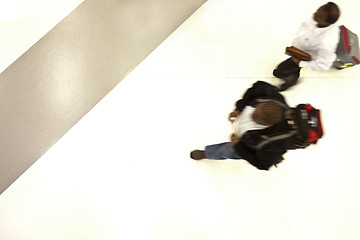 Image showing Moving people from above at the airport