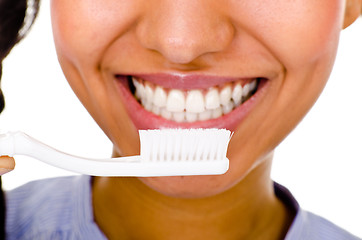 Image showing Afro-american girl brushing her teeth