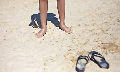 Image showing Beach sandal on the sandy sea coast
