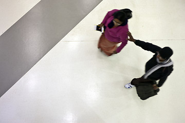 Image showing Moving people from above at the airport