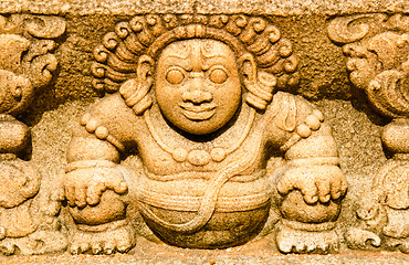 Image showing stone statues that support the arch of steps, leading to a holy 