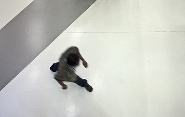 Image showing Moving people from above at the airport