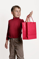 Image showing Child with a red gift bag